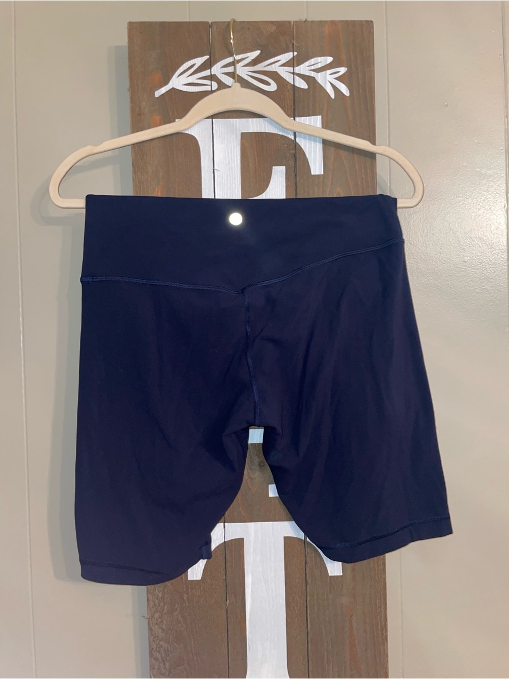 Lululemon Navy Shorts and Black Leggings.